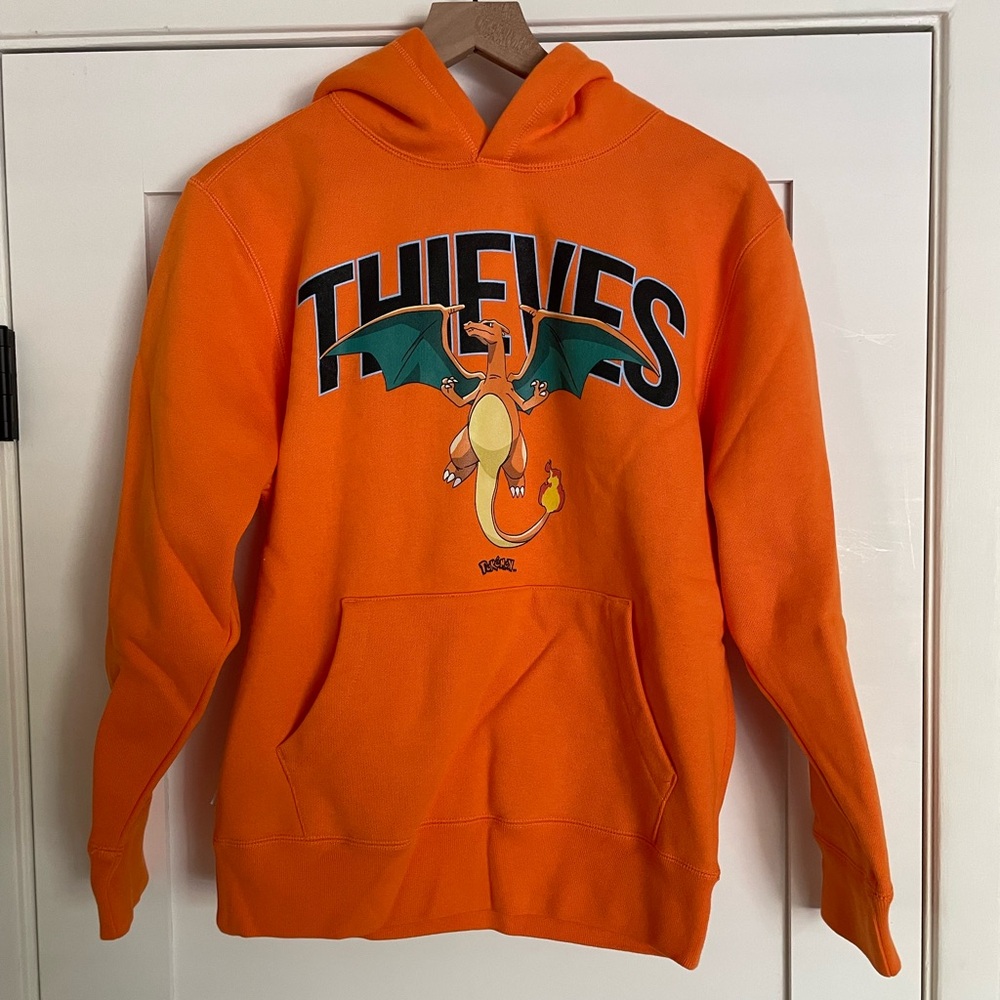 Thieves Orange Graphic Pullover Hoodie with Charizard Design
